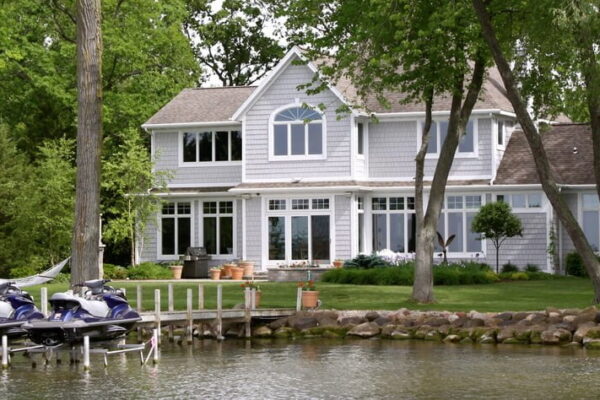Top Questions to Ask When Buying Waterfront Property in Ontario- lovely cottage on a lake